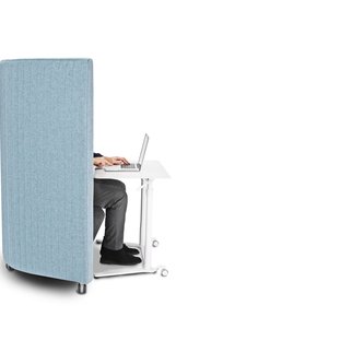 Man works in Muzo's Waltzer portable sofa and workstation in sky blue