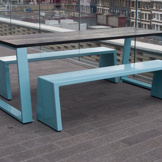 Muzo's Block table with blue legs and benches in rooftop setting