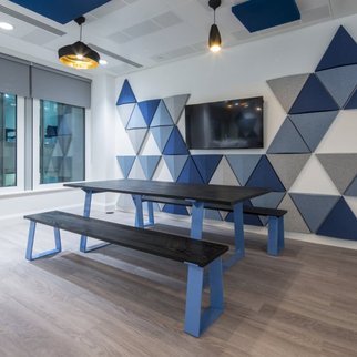 Muzo's Edge table and bench set with blue leg design pictured indoors