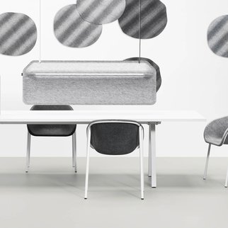 LJ1 shell chairs pictured around meeting table with dividers
