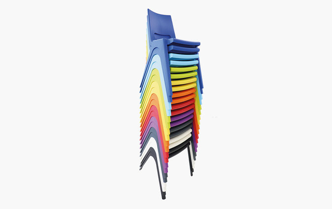Stacked K-seat classroom chairs in an assortment of colors